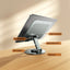 Foldable metal stand for iPad &amp; mobiles with stylish design, 360° rotation, ventilation for cooling, compact &amp; portable. Perfect for studying, working, or watching content anytime, anywhere.